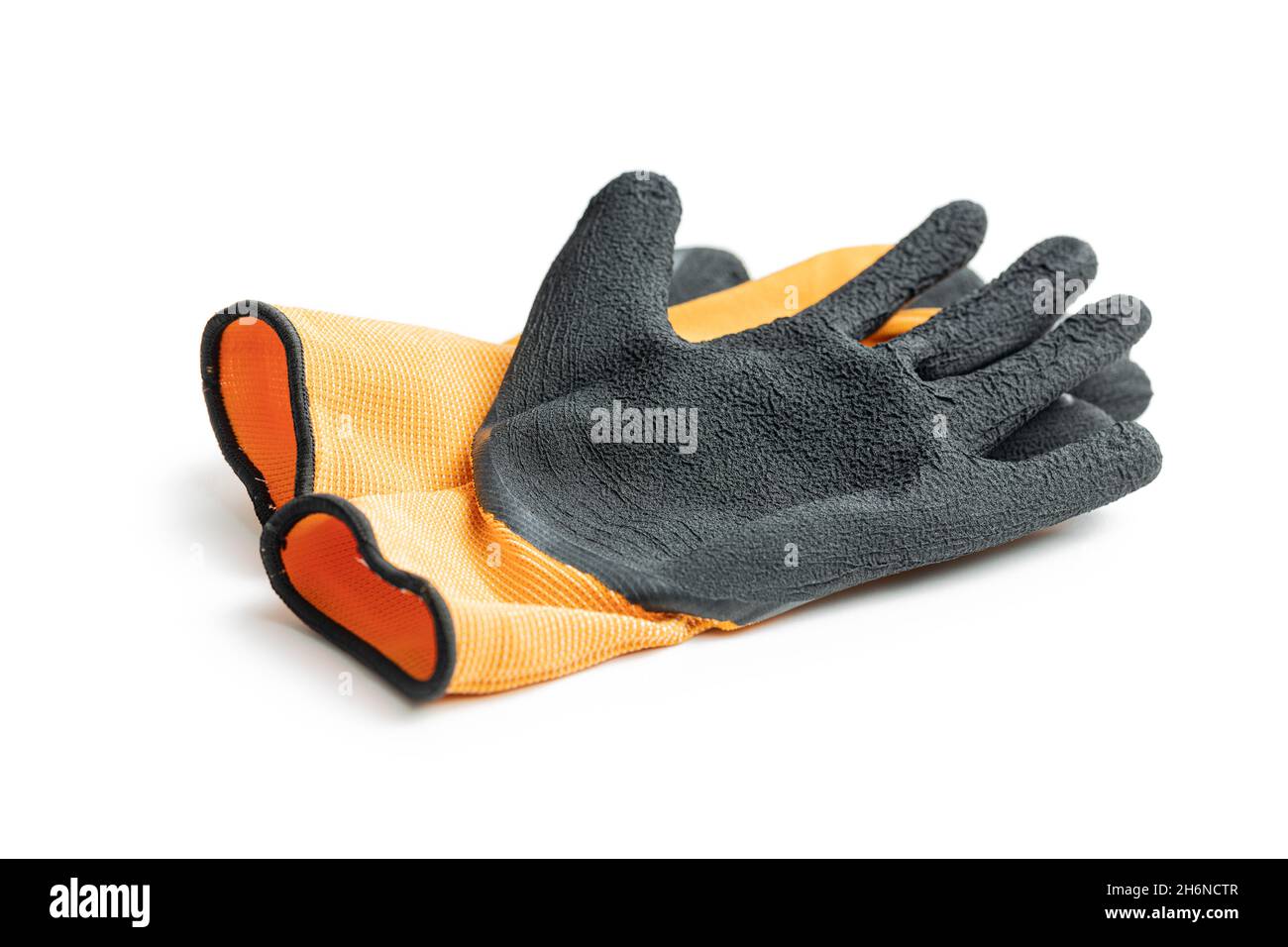 Textile work gloves with rubber isolated on white background. Stock Photo