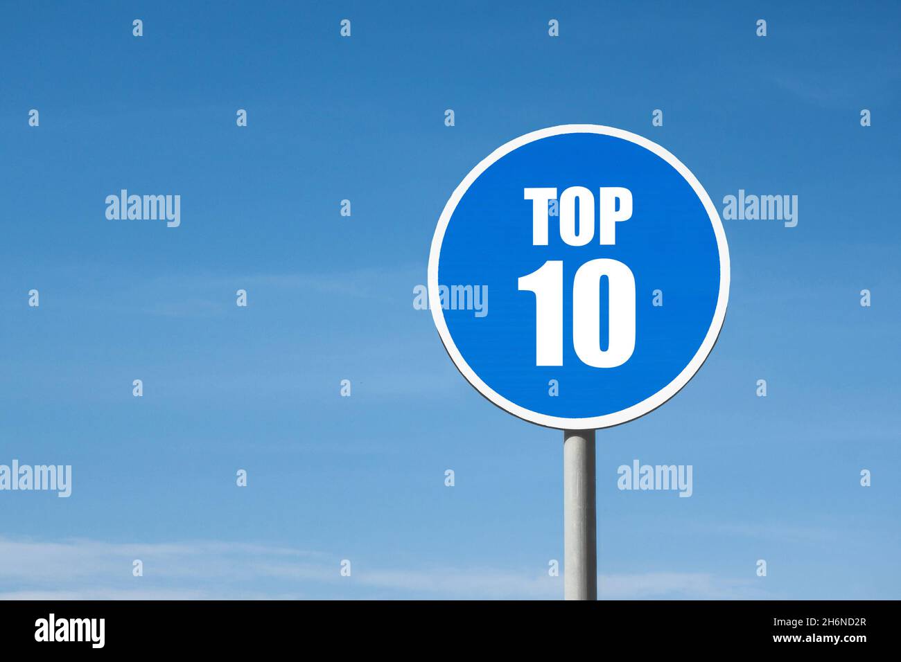 'Top 10' sign in blue round frame on sky background Stock Photo