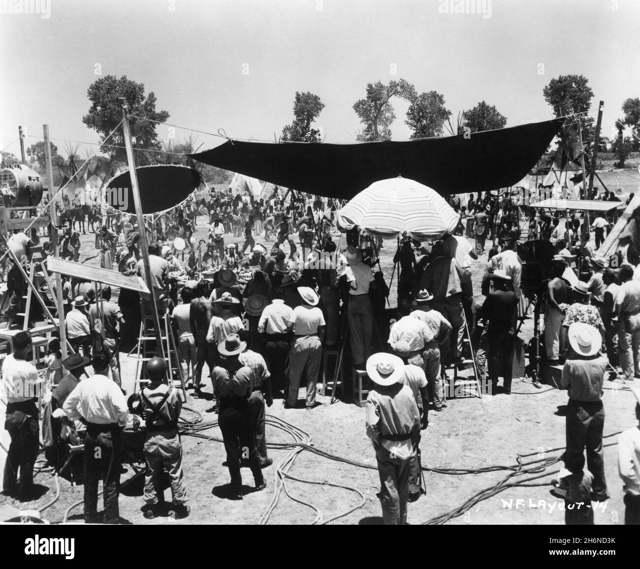 ROBERT WAGNER DEBRA PAGET and JEFFREY HUNTER on set location candid with Camera / Movie Crew during filming of WHITE FEATHER 1955 director ROBERT D. WEBB story John Prebble screenplay Delmer Daves and Leo Townsend music Hugo Friedhofer costume design Travilla cinematographer Lucien Ballard Panoramic Productions / Twentieth Century Fox Stock Photo