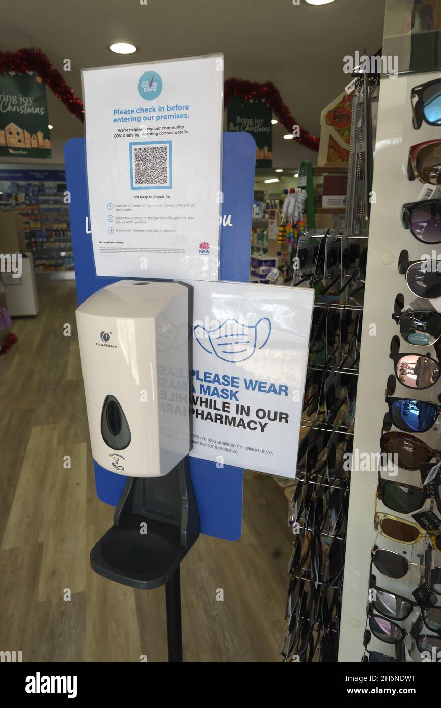 Australian Covid-19 signage placed at shop entrance with hand sanitising station, QR code for checking in and a request that face masks be worn. New S Stock Photo