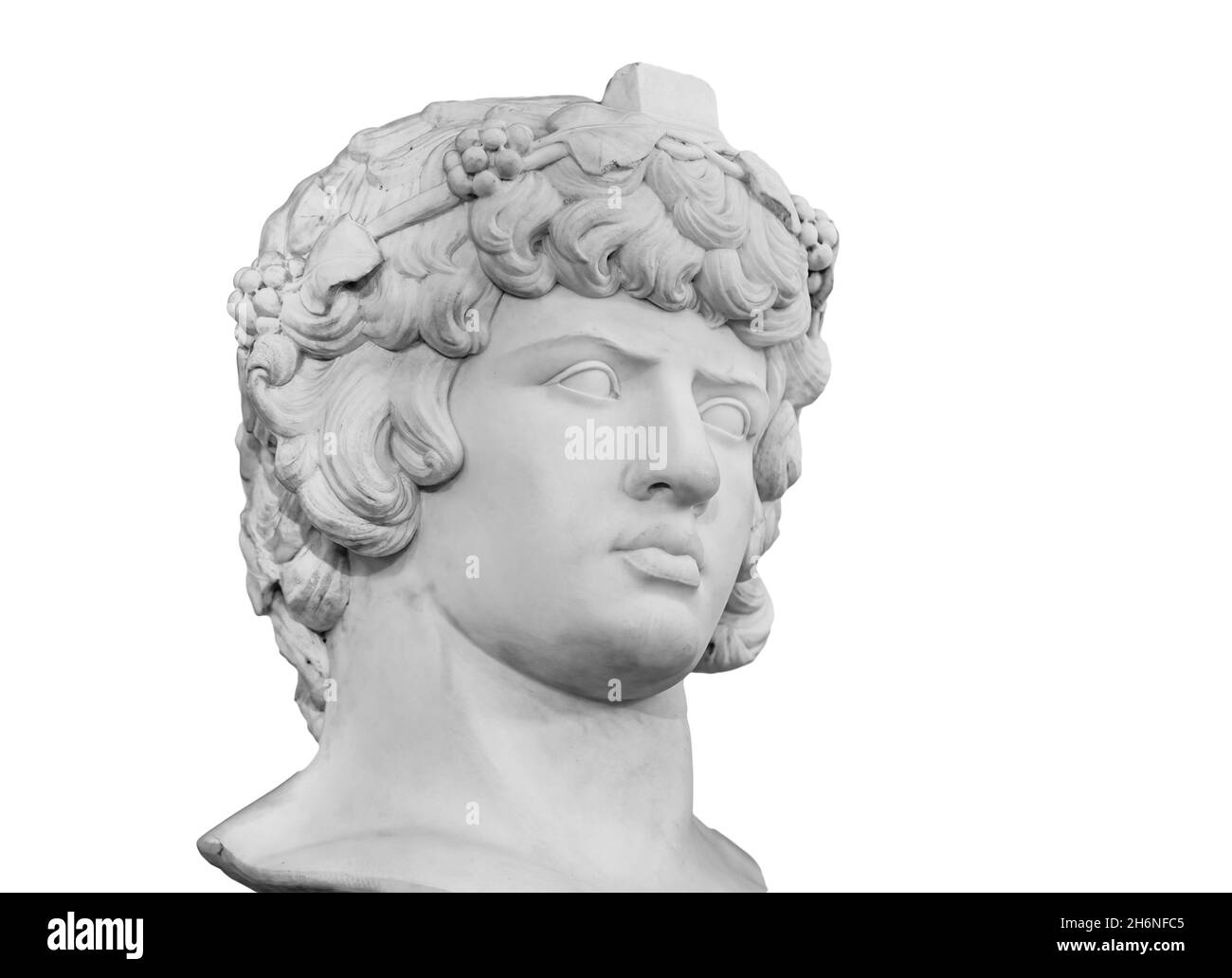 Gypsum copy of famous ancient statue Antinous head isolated on a white background. Plaster antique sculpture young man face. Renaissance epoch Stock Photo