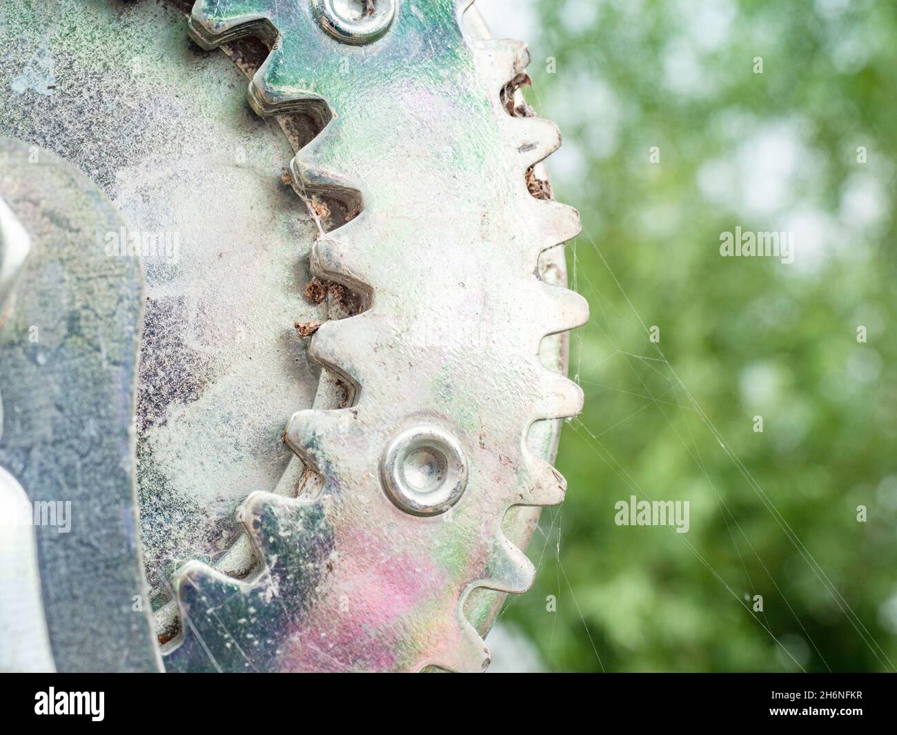 Boat trailer winch close-up, small metal mechanical teeth, yellow rope winch with a polished  stainless steel surface Stock Photo