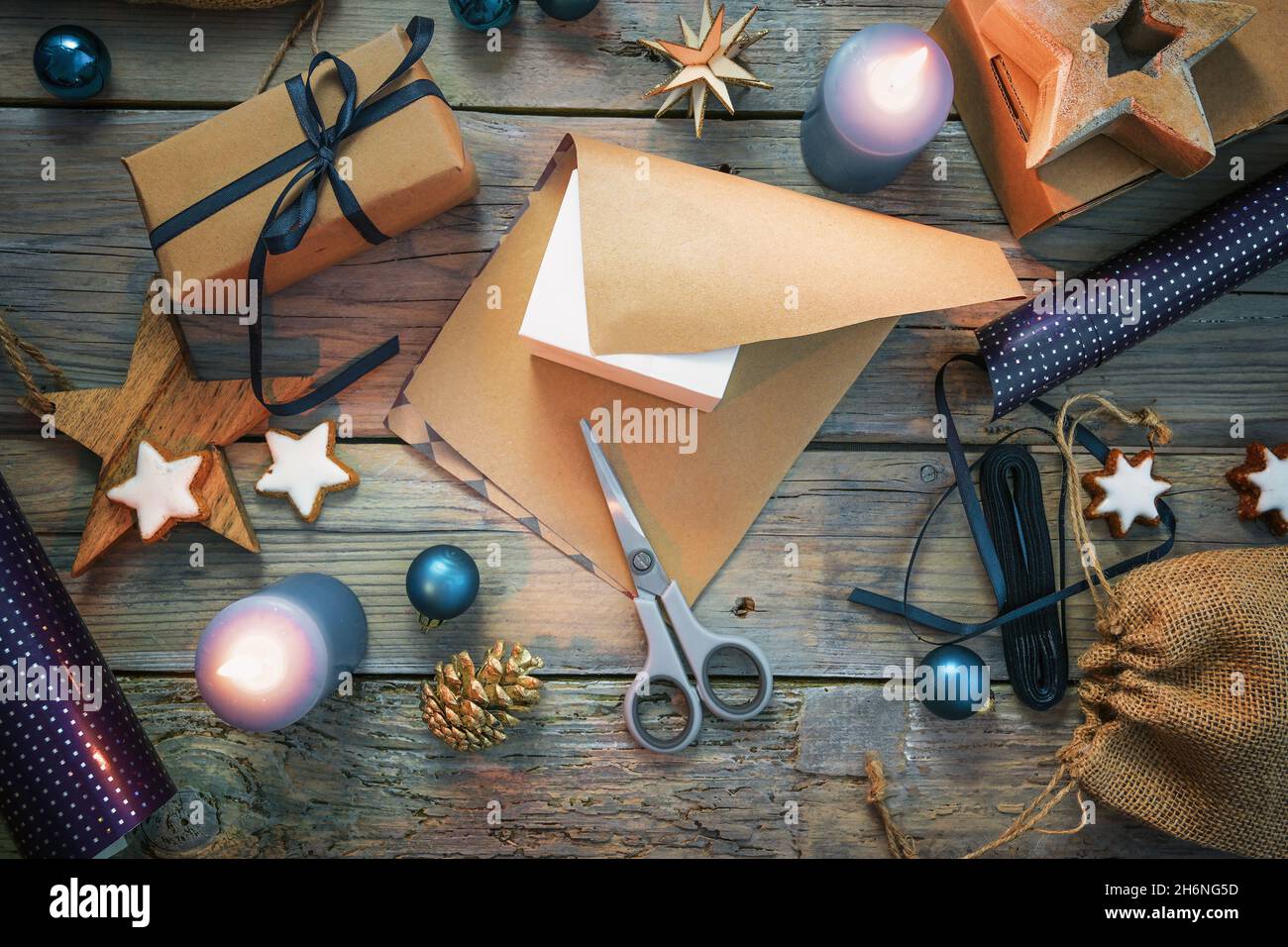 Roll Of Wrapping Paper Scissors Gift Bow And Box On Wooden Table Flat Lay  Stock Photo - Download Image Now - iStock