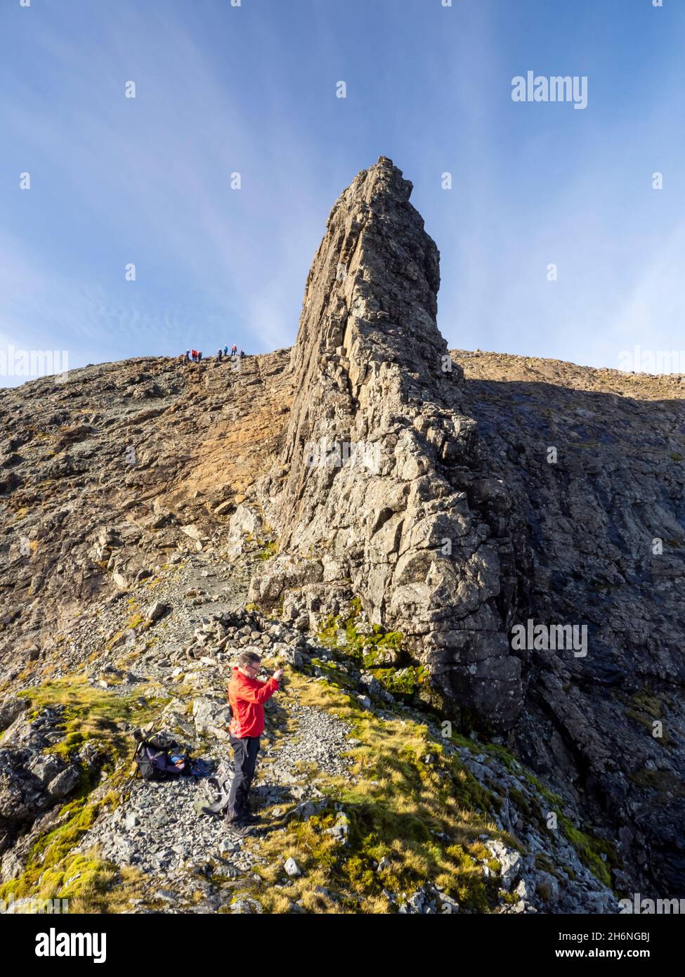 Climbers below the Inaccessible Pinnacle on Sgurr Dearg on the Cuillin Ridge on the Isle of Skye, Scotland, UK. The In Pin is the hardest of all Scotl Stock Photo