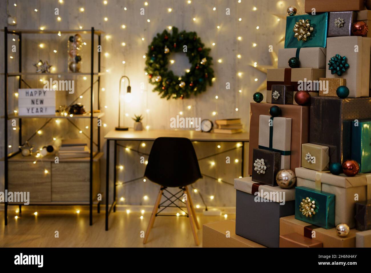 decorated home office with heap of gifts, led lights and christmas  decorations Stock Photo - Alamy