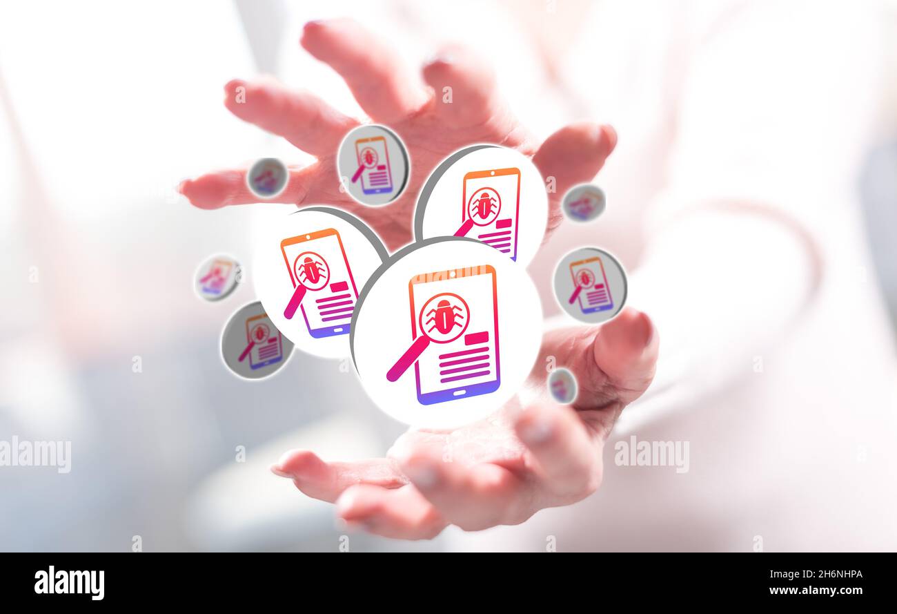 Software testing concept between hands of a woman in background Stock Photo