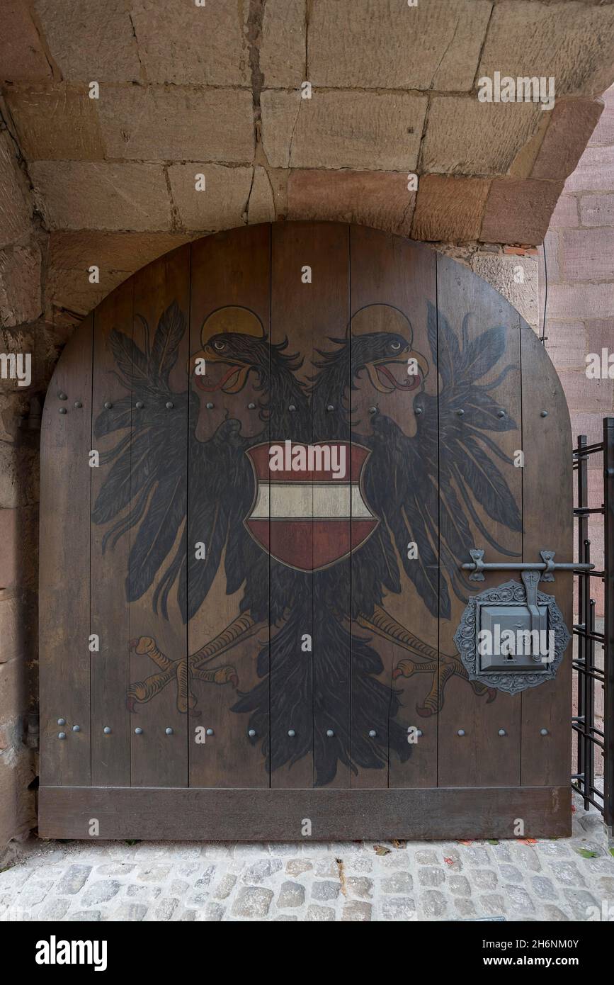 The double-headed eagle on the medieval gate of the Kaiserburg, Nuremberg, Middle Franconia, Bavaria, Germany Stock Photo