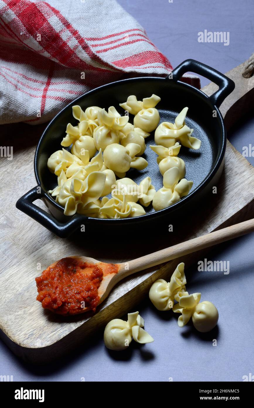 Saccottini, Italian pasta in pot and spoon with tomato sauce, pasta Stock  Photo - Alamy