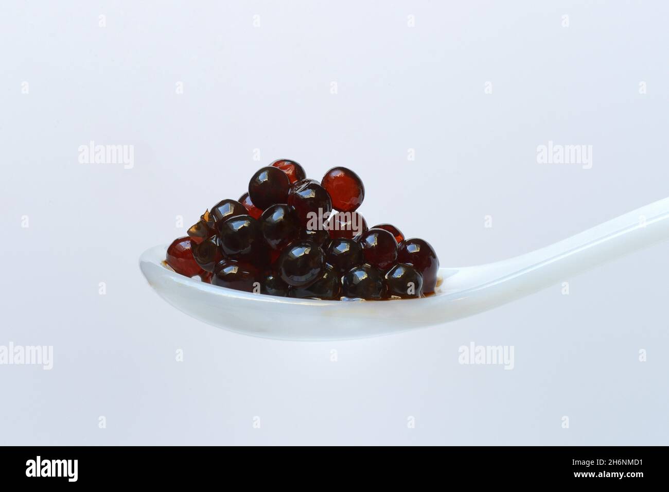 Aceto pearls in spoon, Aceto Balsamico di Modena, vinegar Stock Photo
