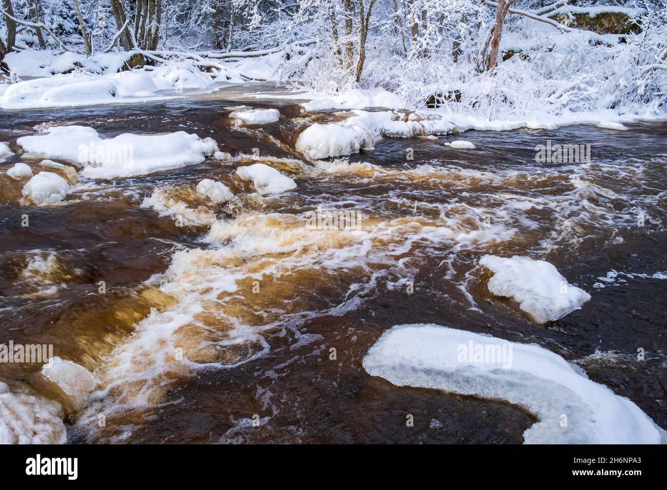 River with flowing water in the winter Stock Photo