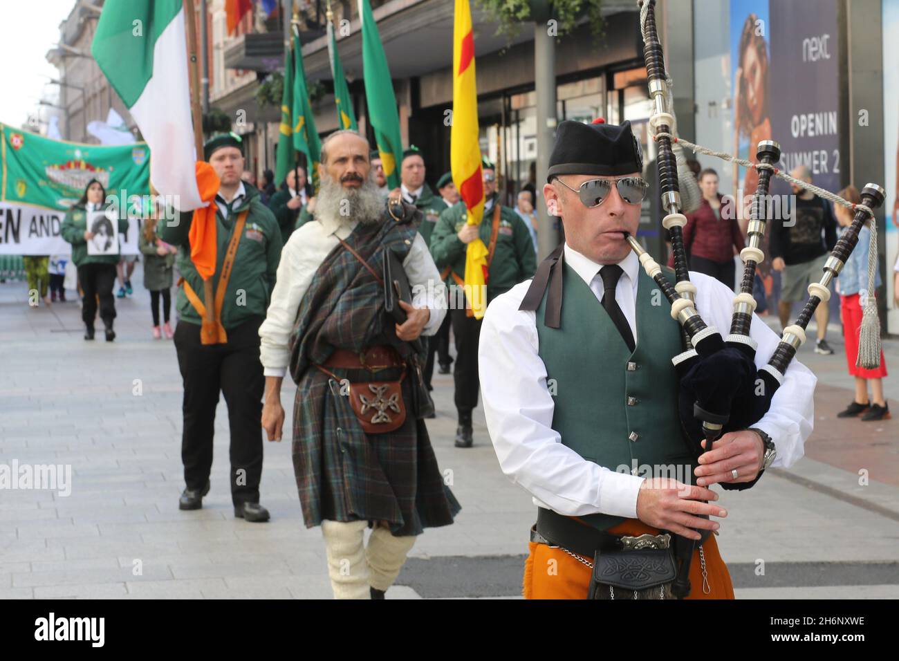 A military parade has taken place in Dublin to commemorate the 1916 Rising. Activists in military style uniform marched through Dublin followed by a s Stock Photo