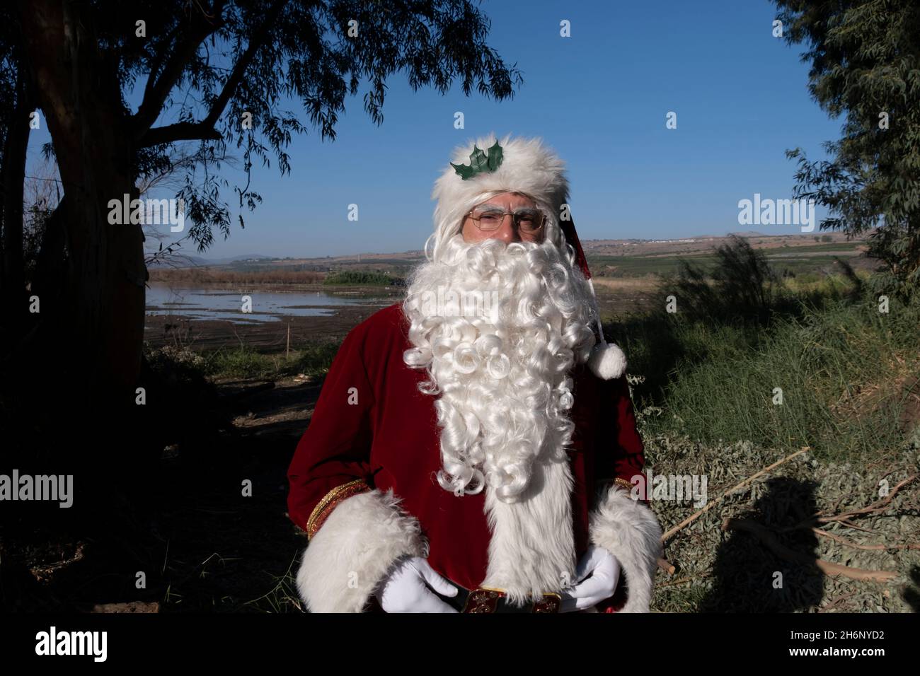 Issa Kassissieh, an Arab Orthodox Christian and Israel’s only certified Santa Claus, at the eastern side of the Sea of Galilee in Israel. Stock Photo