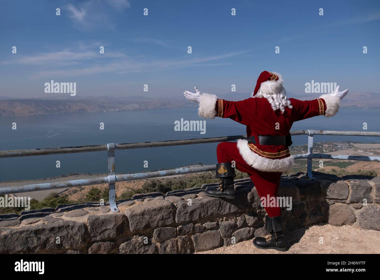 Issa Kassissieh, an Arab Orthodox Christian and Israel’s only certified Santa Claus reacts as hew stands at Mitzpe Shalom, also known as Peace Lookout located at the eastern side of the Sea of Galilee in Israel. Stock Photo