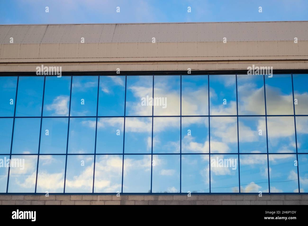 Clouds reflecting on a building with mirrored glass Stock Photo - Alamy