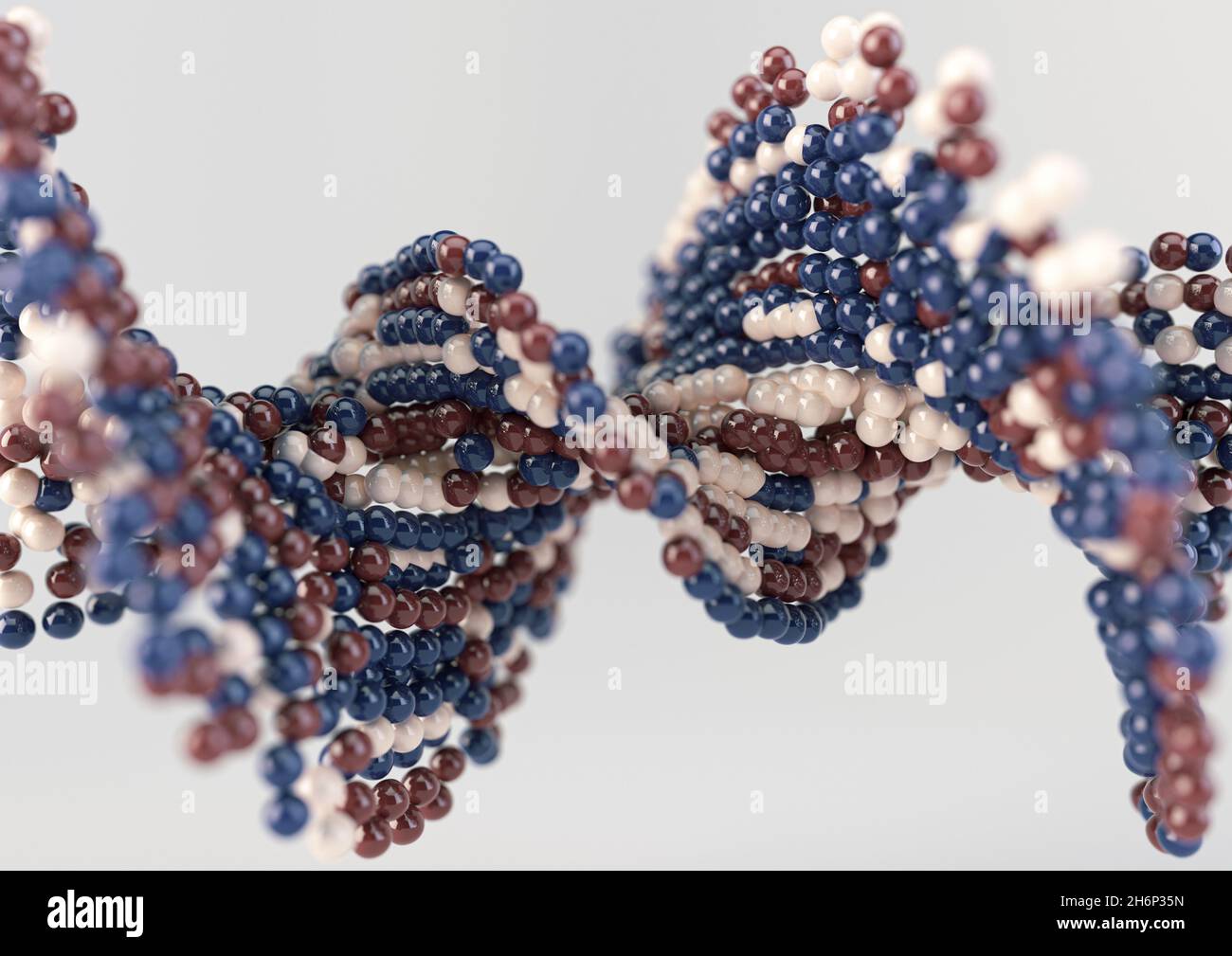 A model of a sequenced pattern of DNA style red blue and cream atom balls on an isolated background - 3D render Stock Photo