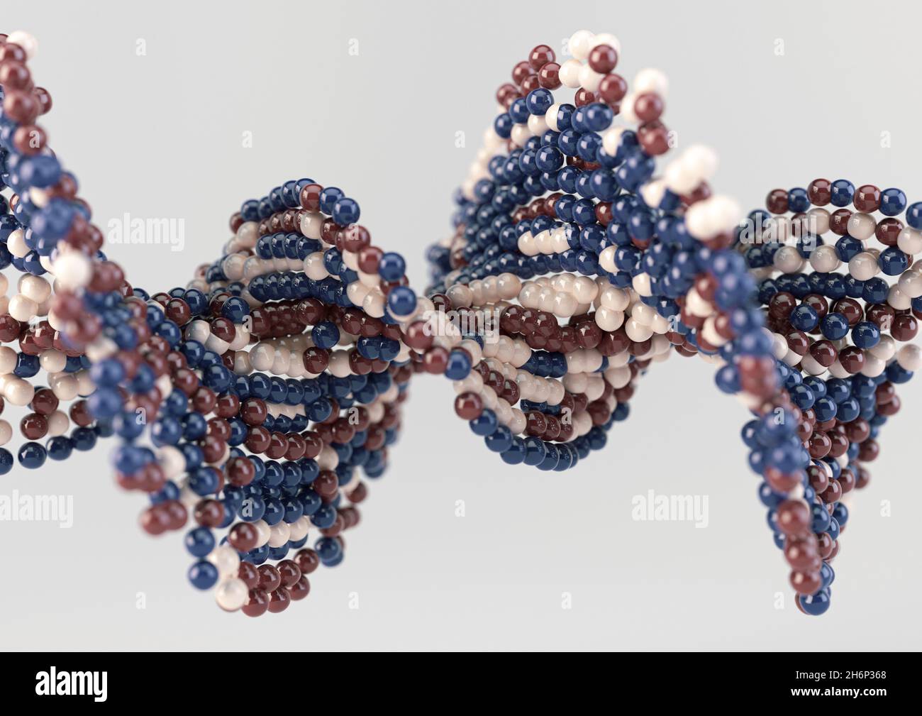 A model of a sequenced pattern of DNA style red blue and cream atom balls on an isolated background - 3D render Stock Photo