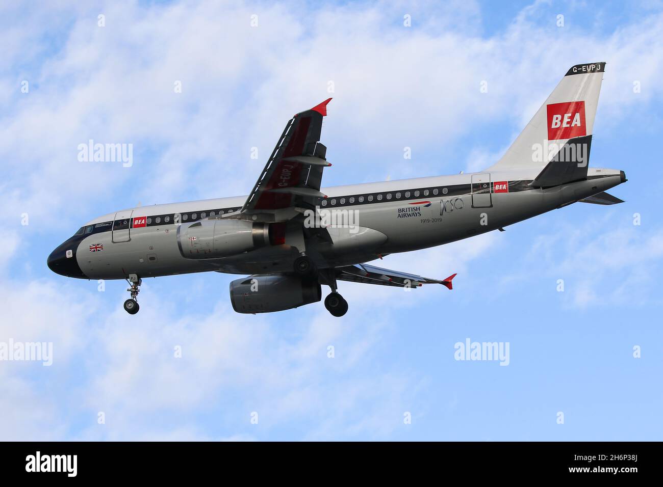 An Airbus A319 flying for British Airways, wearing a special livery celebrating the Airline's centenary, arrives at London Heathrow Airport Stock Photo