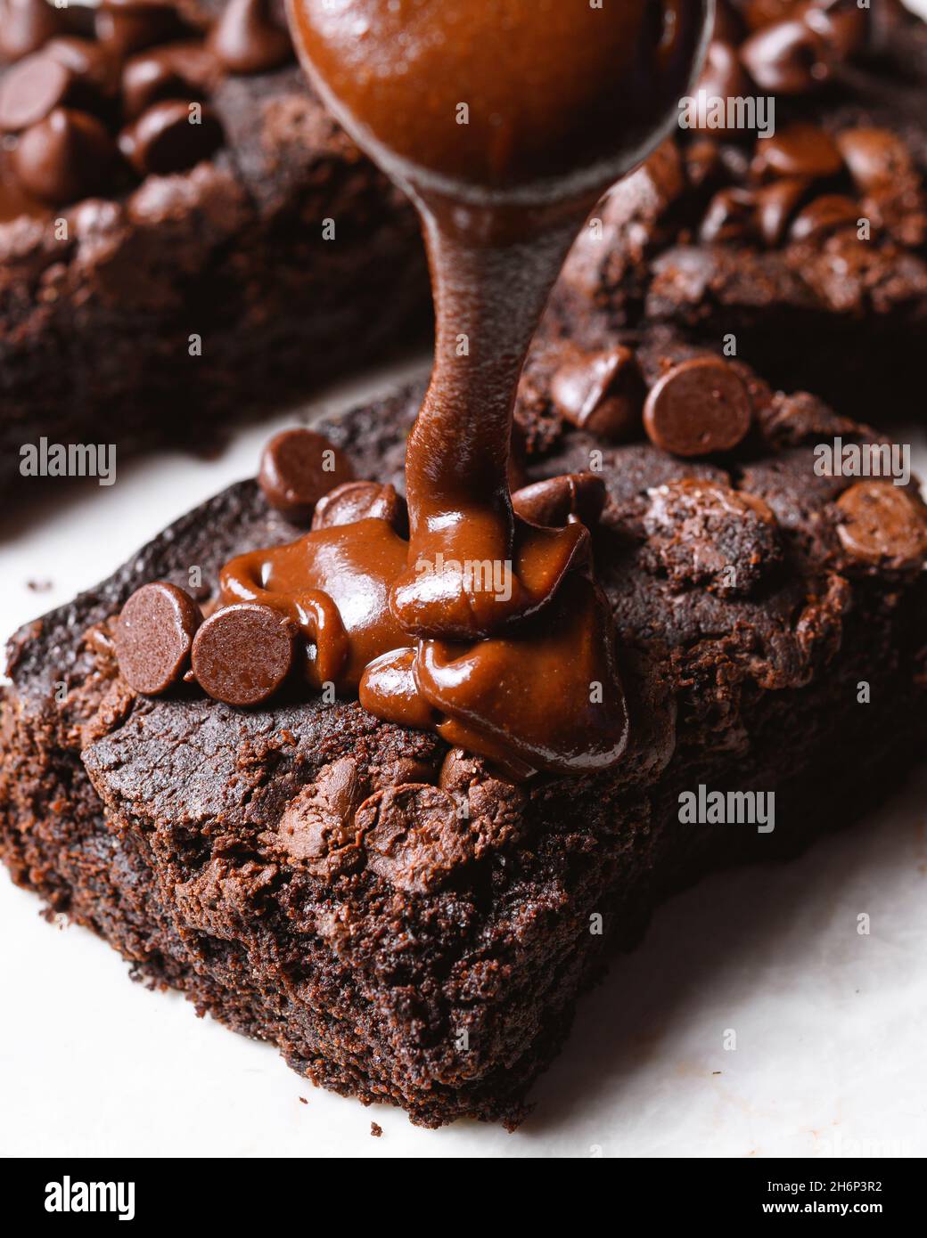 Delicious chocolate ganache on a piece of brownie Stock Photo Alamy