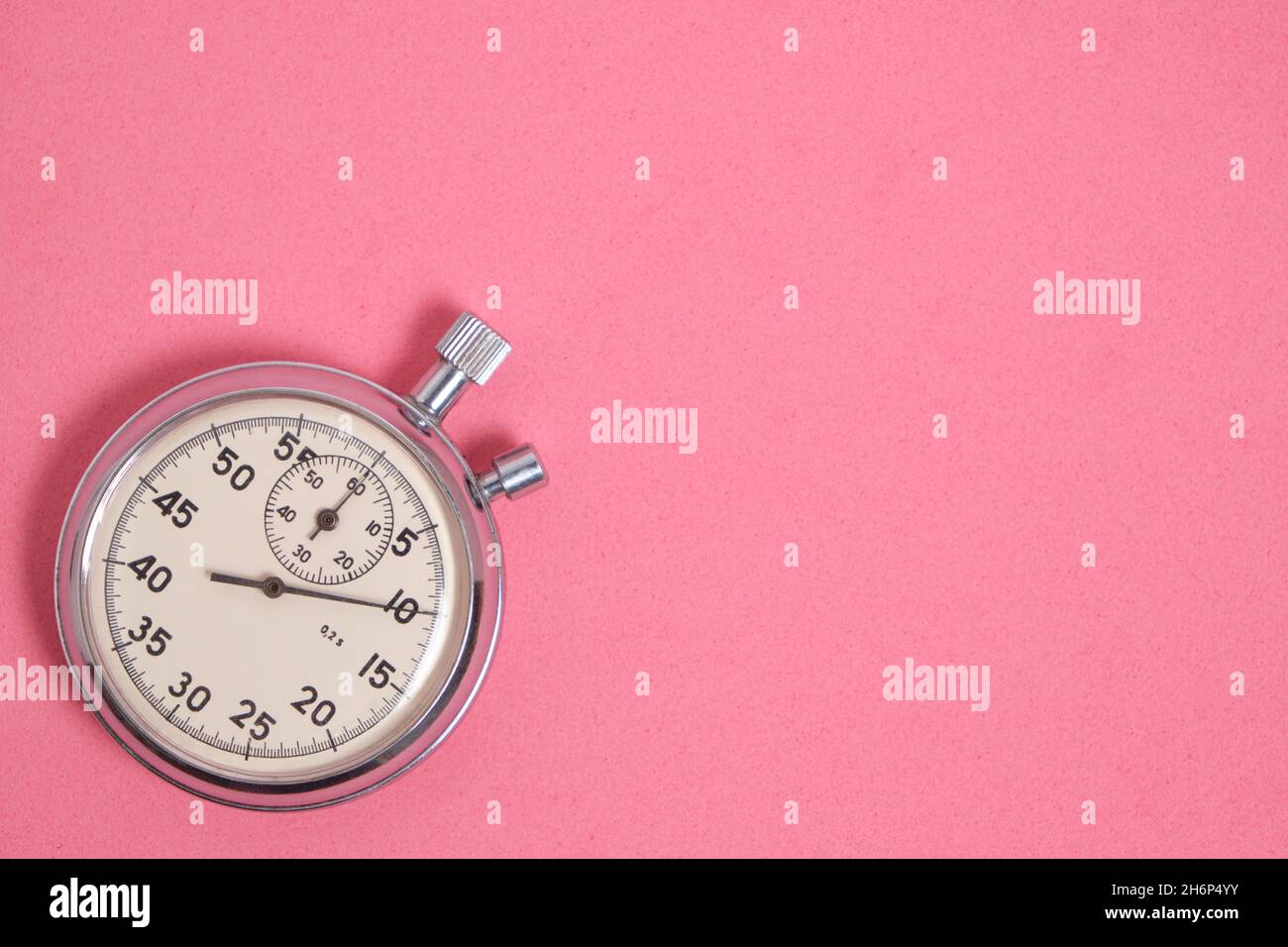 Stopwatch pink background.Doing sports and jogging Stock Photo Alamy
