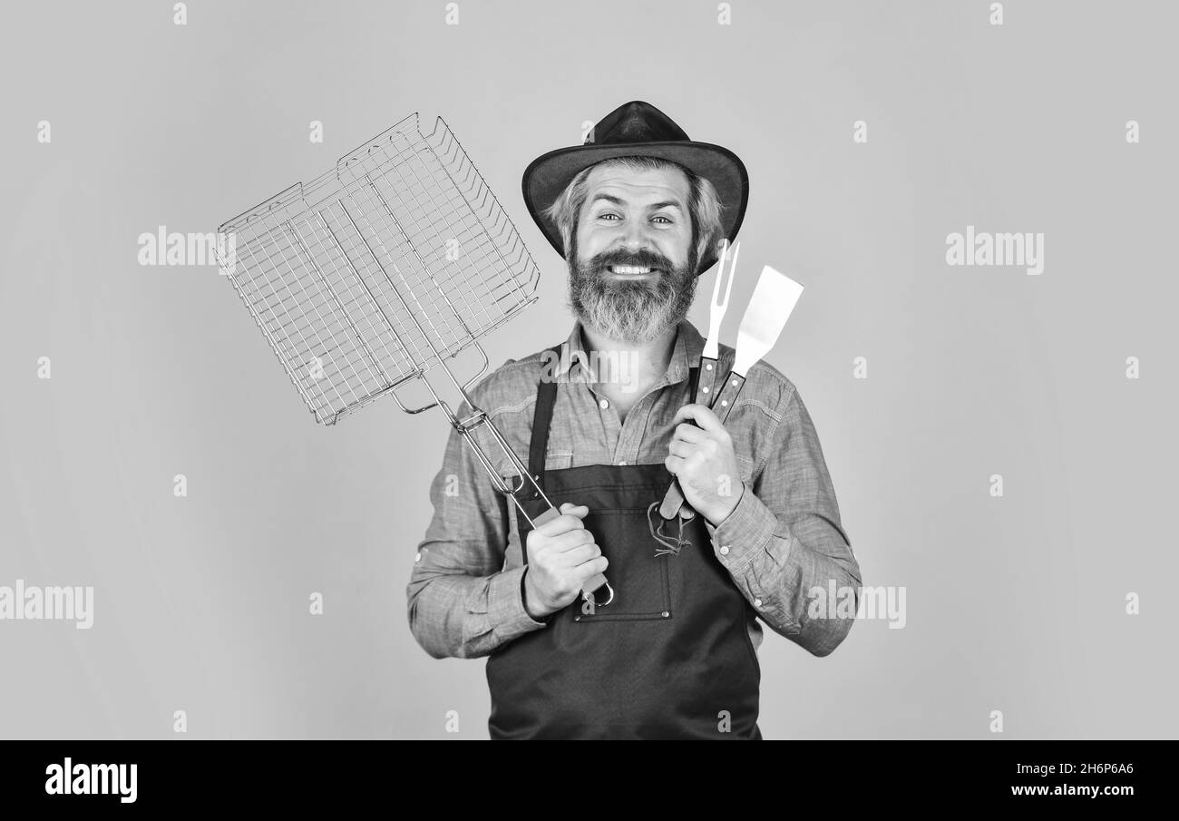 Cooking steak. Cooking utensils. Farmer with bbq equipment. Summer