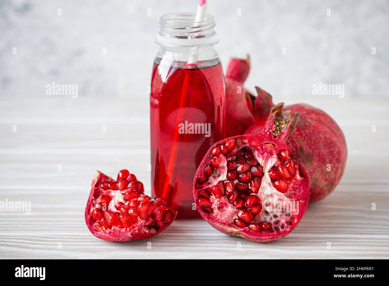 Pomegranate juice in bottle and fruit Stock Photo Alamy