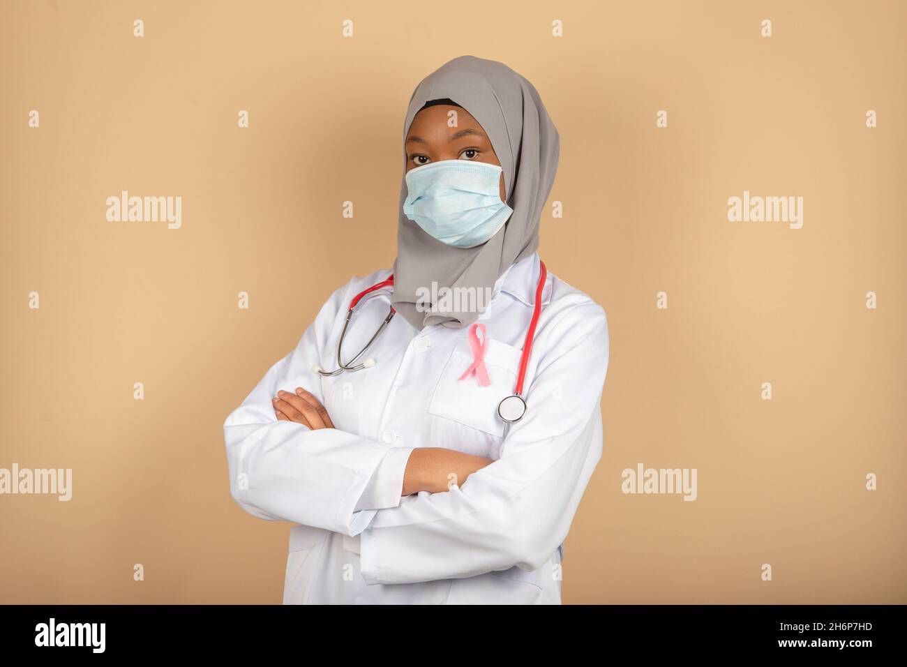 Portrait of an African American female doctor wearing a surgical mask ...