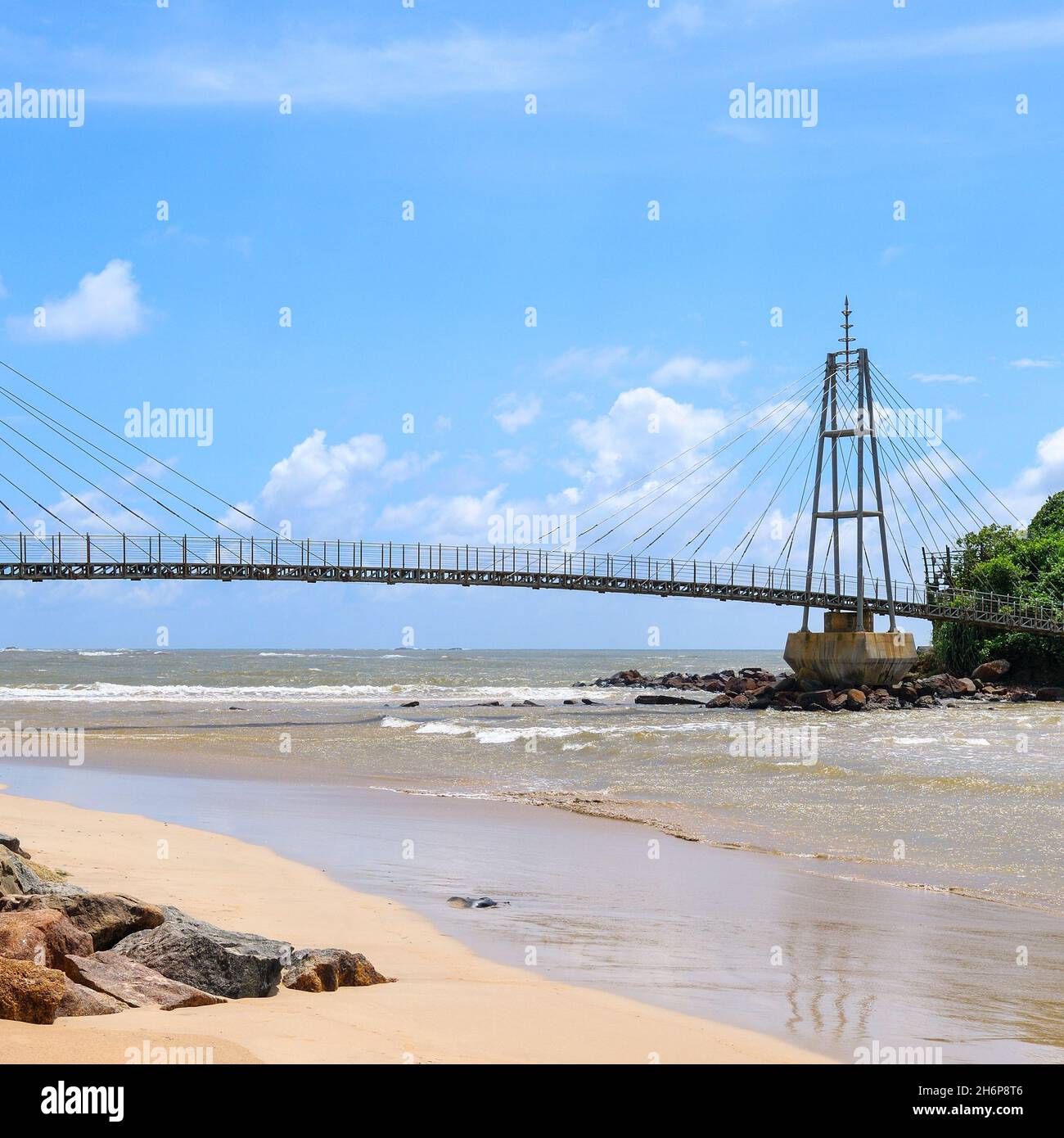 Modern pedestrian bridge on an island in the ocean. Matara. Sri Lanka ...
