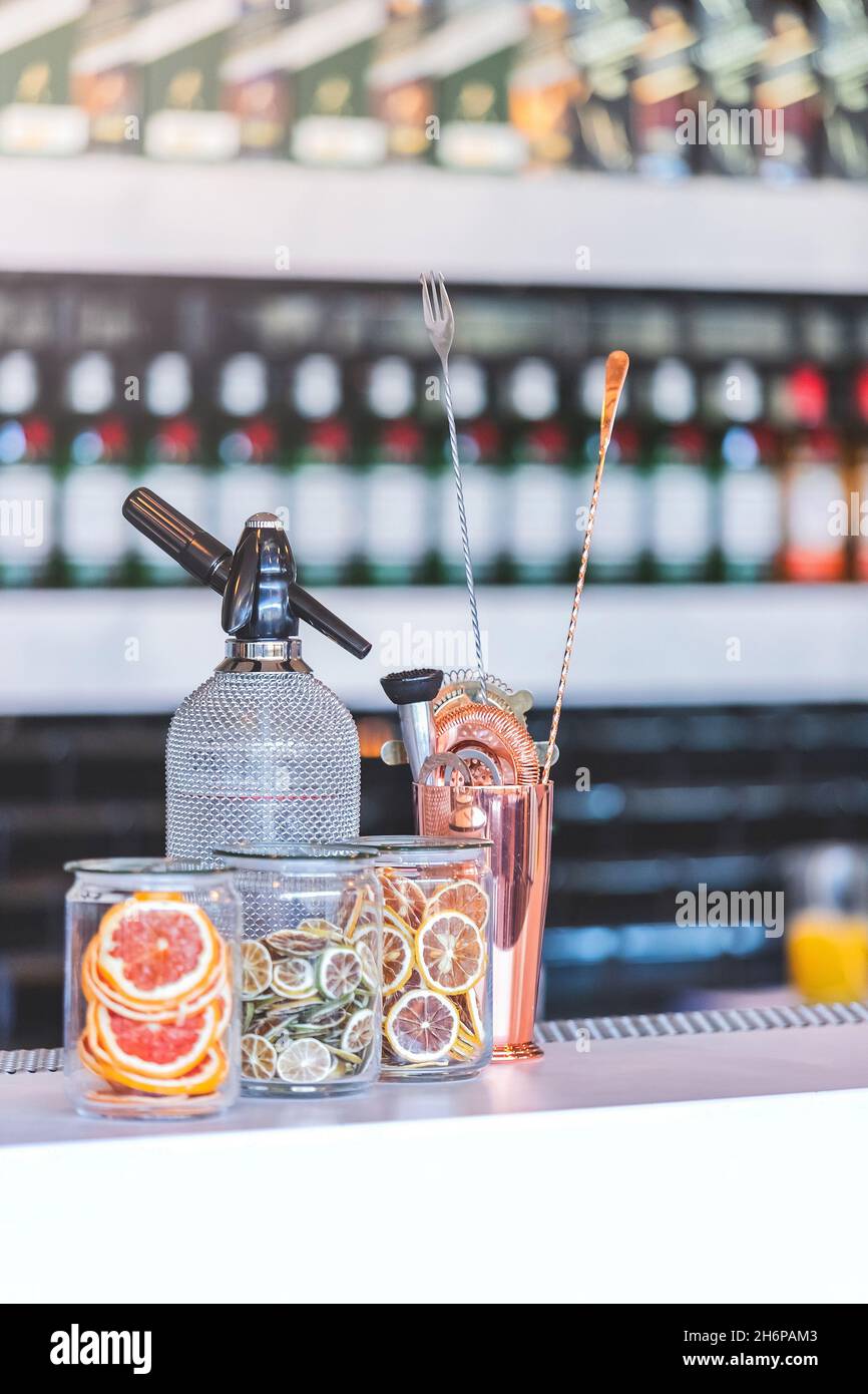 Johannesburg, South Africa - 22nd June, 2021: Cocktail bar with shaker and garnishing on bar counter. Stock Photo