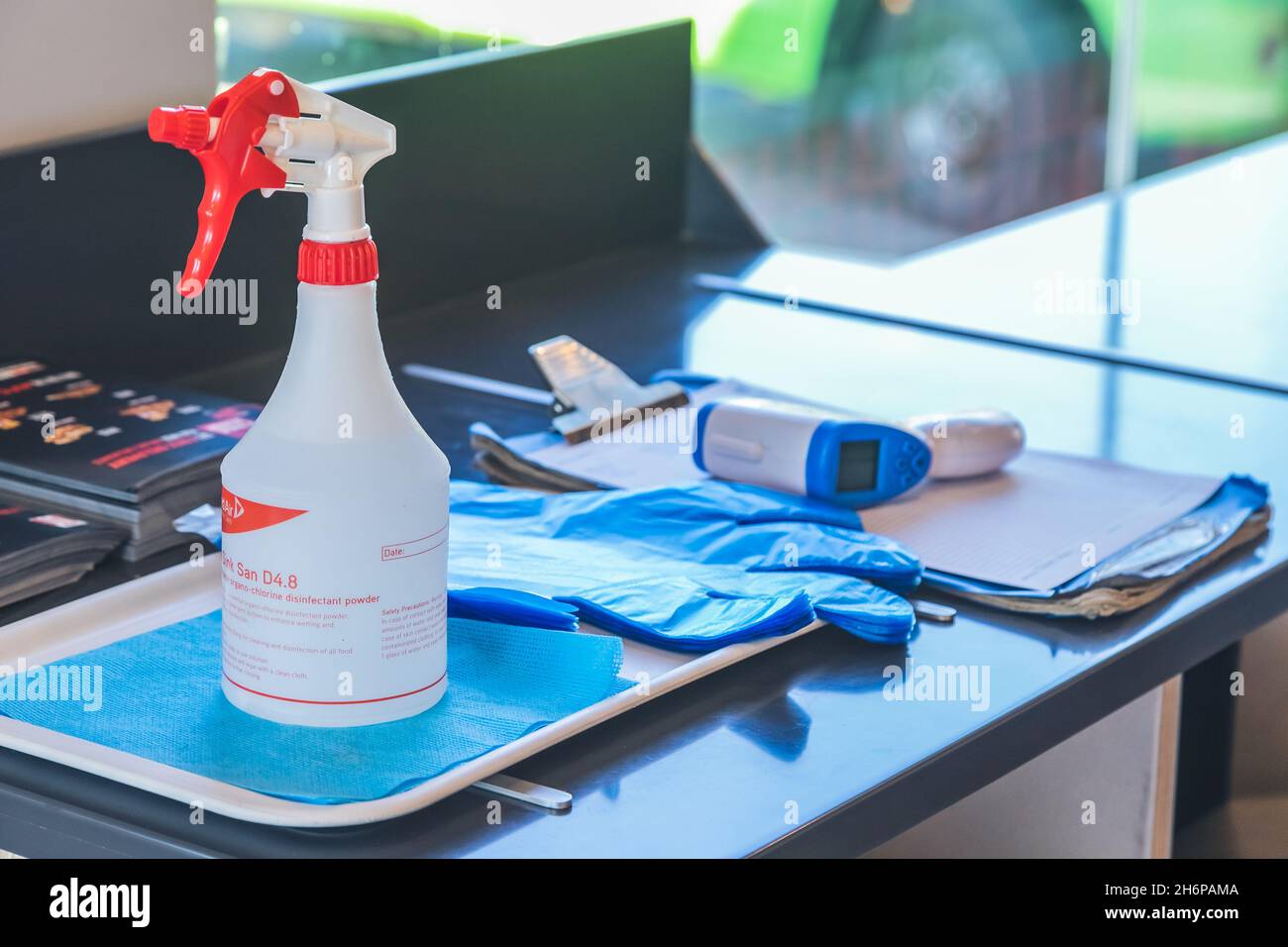 Johannesburg, South Africa - 22nd June, 2021: Sanitiser spray, gloves and thermometer at entrance to venue. Stock Photo