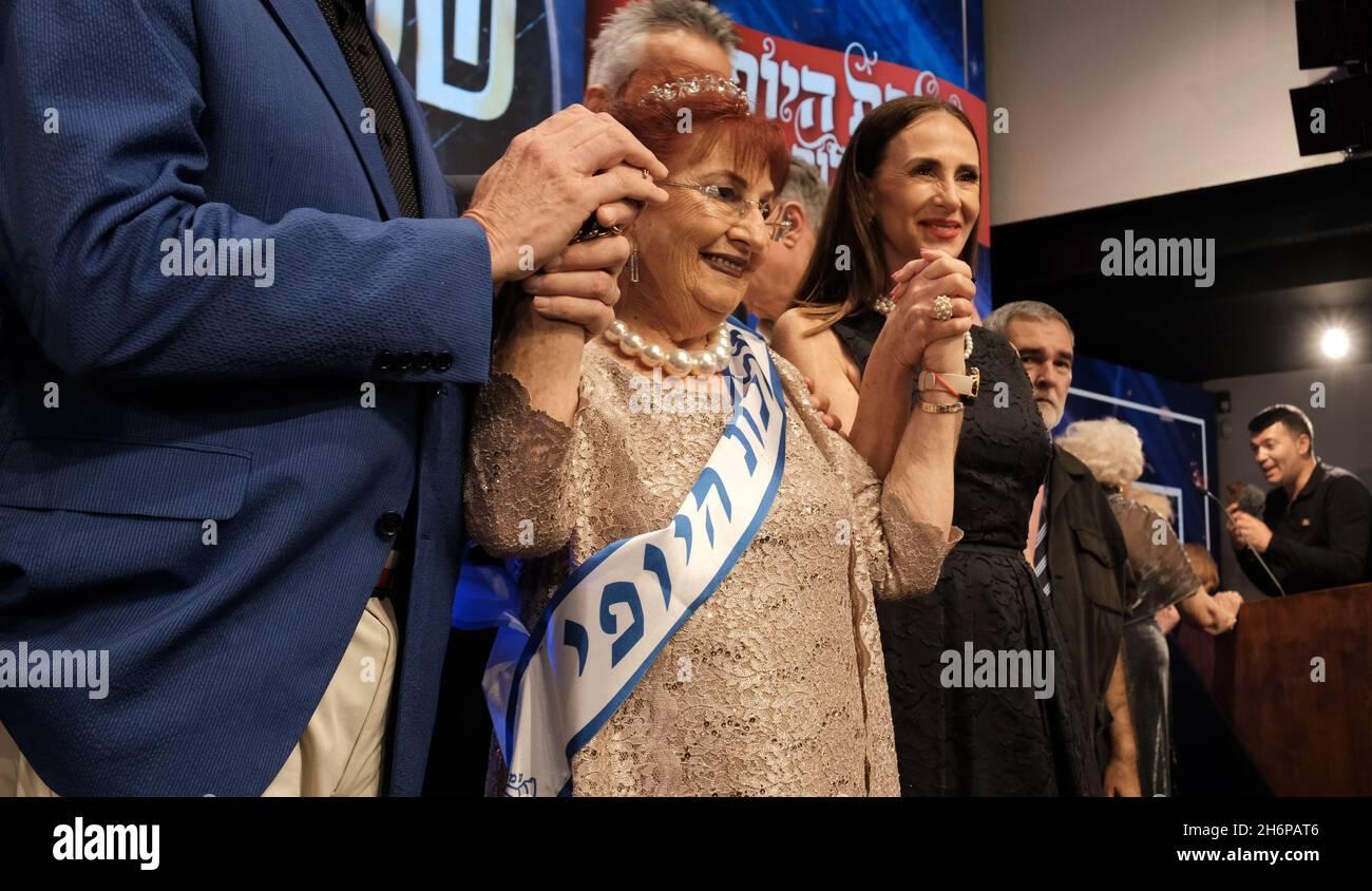 Holocaust survivor Selina Steinfeld, 86, who was born in Romania celebrates after being crowned 'Miss Holocaust Survivor' in the annual Holocaust Survivor Beauty Pageant at the Friends of Zion Museum on November 16, 2021 in Jerusalem, Israel. Hundreds of Holocaust survivors applied to be in the competition, which was organized by the Christian evangelist museum Friends of Zion and Yad Ezer L’Haver, an organization dedicated to assisting needy Holocaust survivors in Israel. Stock Photo