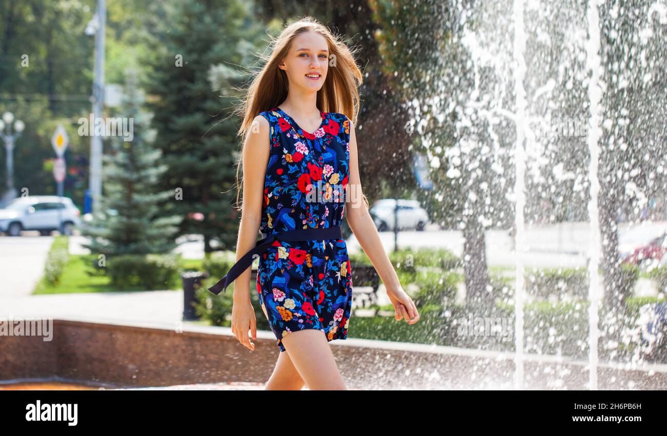 portrait of a young blonde girl in blue dress Stock Photo - Alamy