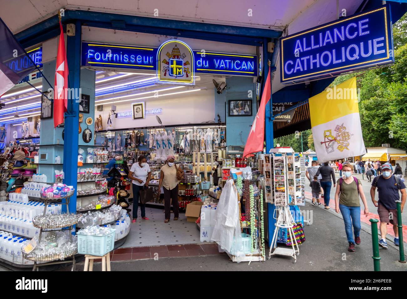Shop selling Virgin Mary statues and other catholic products and gifts in Lourdes, France Stock Photo