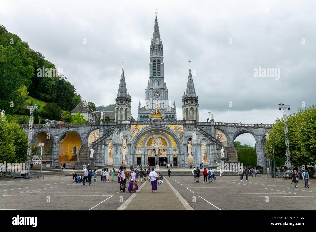Pilgrims in the sanctuary of Our Lady of Lourdes, France Stock Photo