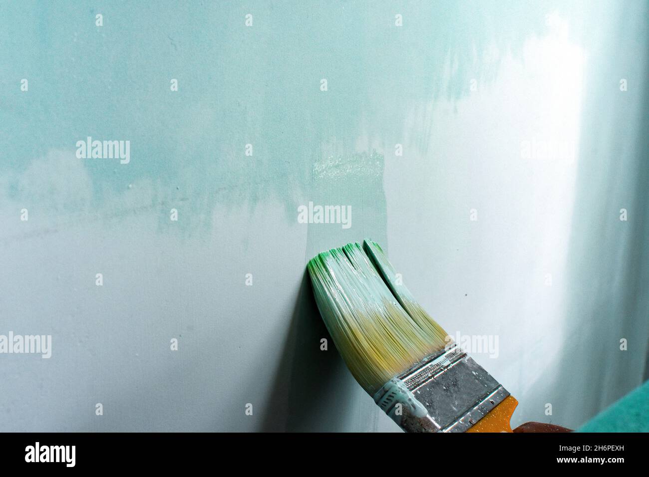 Hand painting wall with roll and brush Stock Photo Alamy