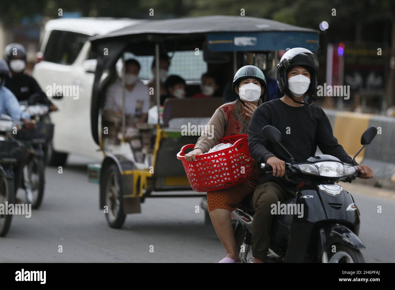 Cambodia, Cambodia. 17th Nov, 2021. People drive vehicles on Norodom Boulevard in Phnom Penh, Cambodia, Nov. 17, 2021. TO GO WITH 'Feature: Chinese vaccines help reinvigorate Cambodia from COVID-19 restrictions' Credit: Phearum/Xinhua/Alamy Live News Stock Photo