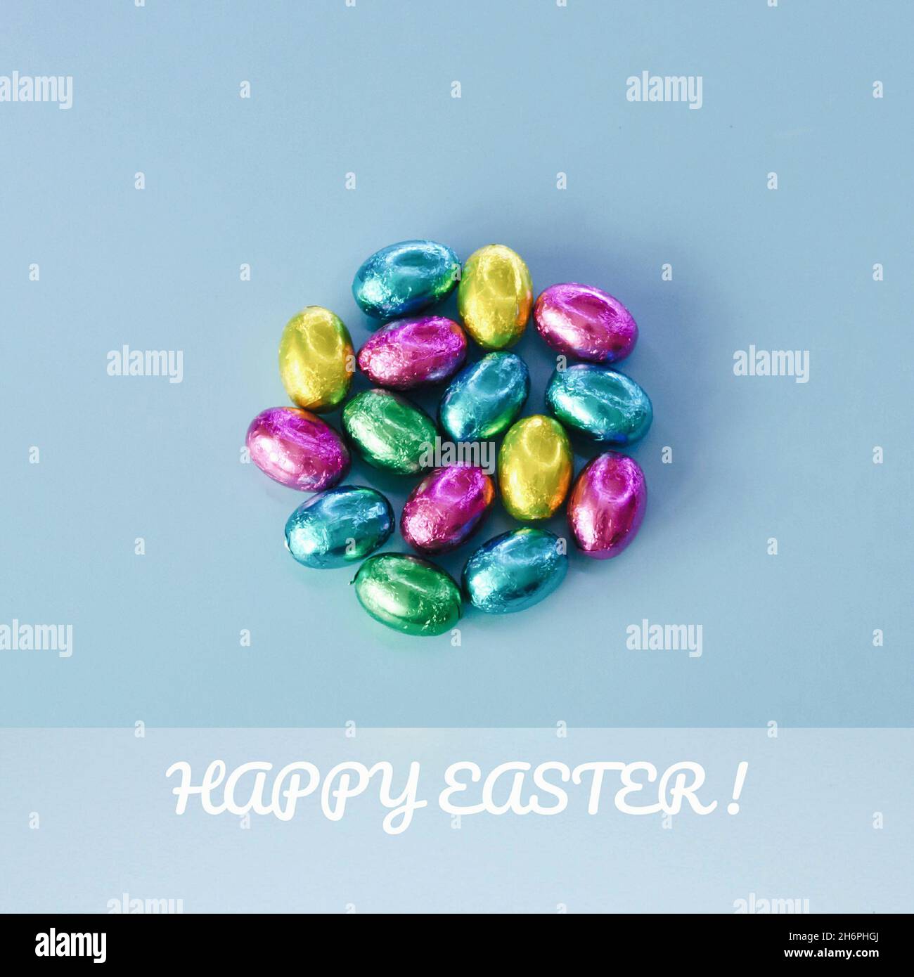 Easter greeting card with traditional colorful chocolate easter eggs Stock Photo