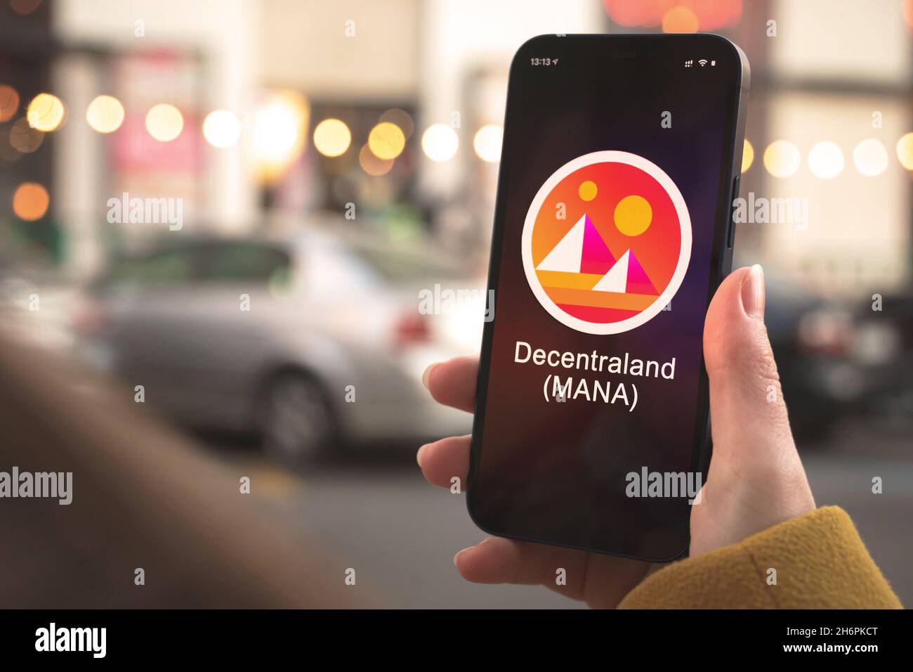 Decentraland MANA cryptocurrency symbol, logo. Business and financial  concept. Hand with smartphone, screen with crypto icon closeup Stock Photo  - Alamy