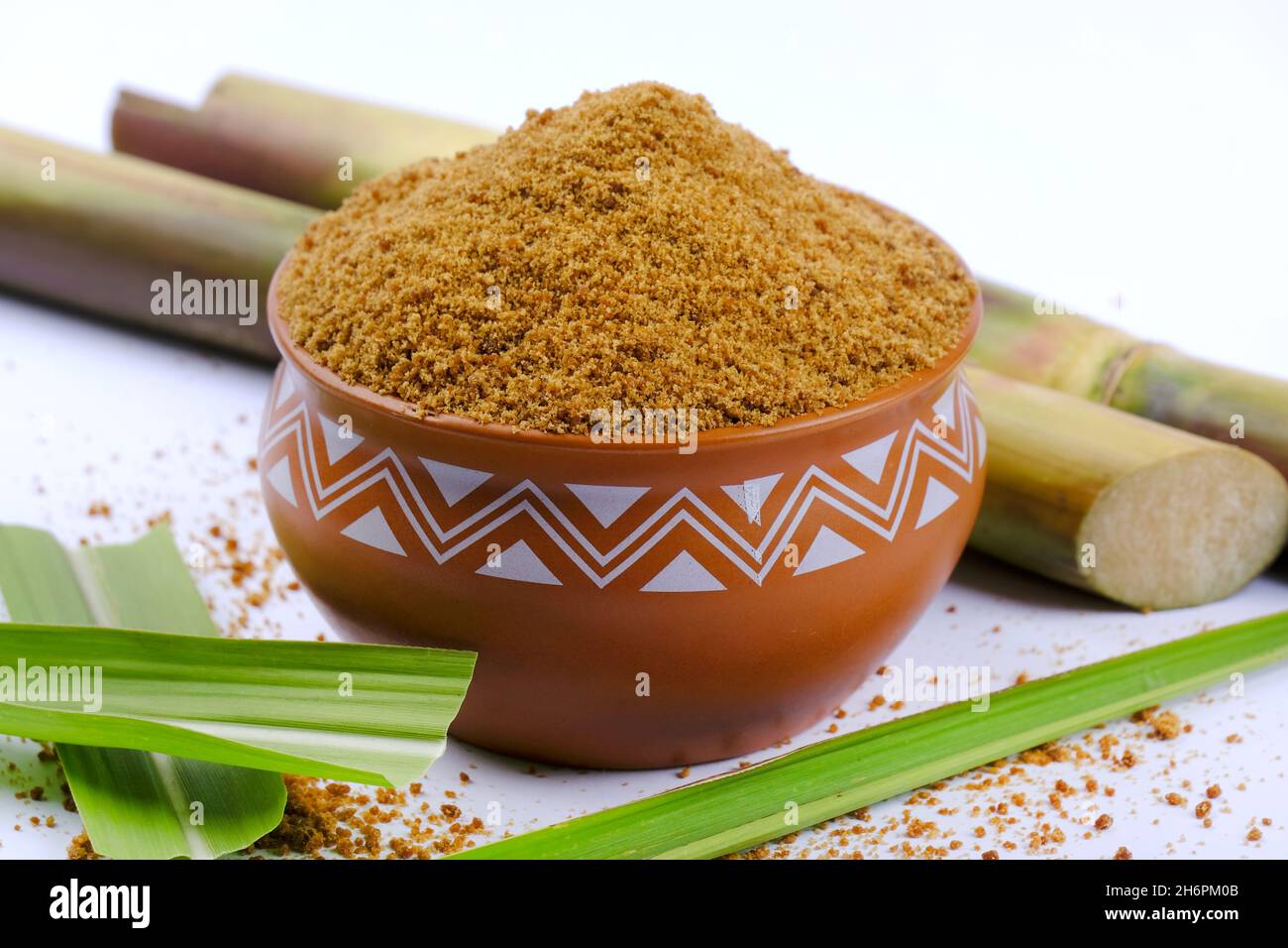 Jaggery Powder And Sugarcane Isolated On White Background. Jaggery Is ...