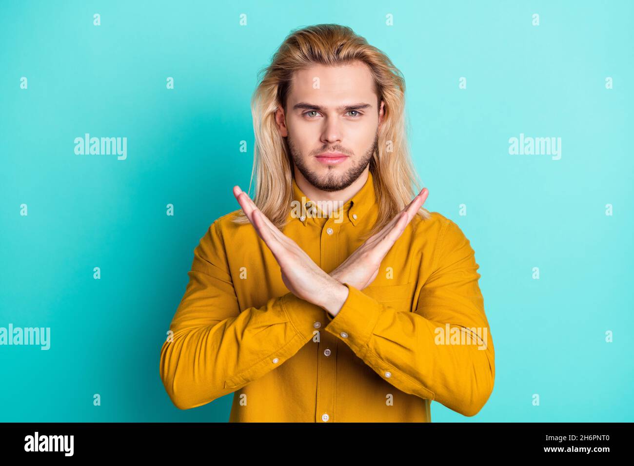 Photo of young handsome guy crossed hands show rejection enough no stop ...