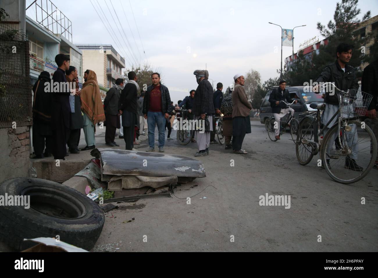 Kabul, Afghanistan. 17th Nov, 2021. People gather at the site of an explosion in Kabul, Afghanistan, Nov. 17, 2021. At least one civilian was killed and six others were wounded in twin explosions in western part of Kabul, capital of Afghanistan on Wednesday, an official confirmed. Credit: Kabir/Xinhua/Alamy Live News Stock Photo