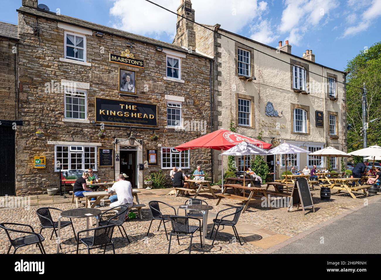 The Kings Head and the Golden Lion Hotel in the upland village of Allendale Town on the Pennines, Northumberland UK Stock Photo