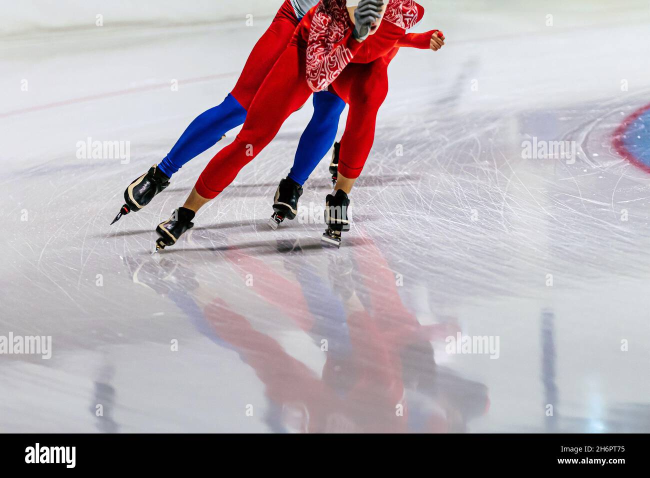 two male speed skaters running in ice ring Stock Photo Alamy