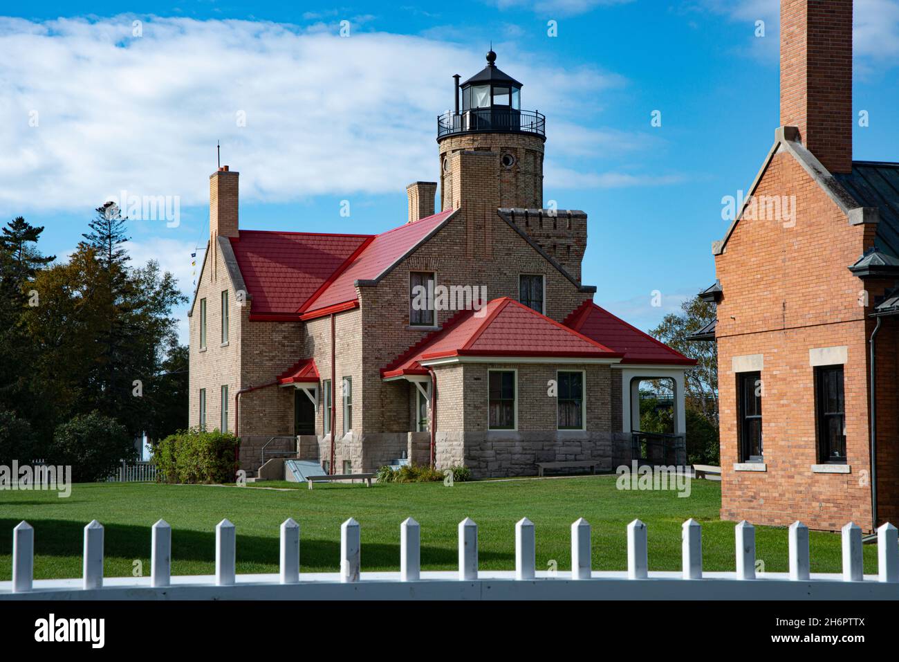 Old Mackinac Point lighthouse marks the junction of Lake Michigan and Lake Huron in Michigan USA Stock Photo