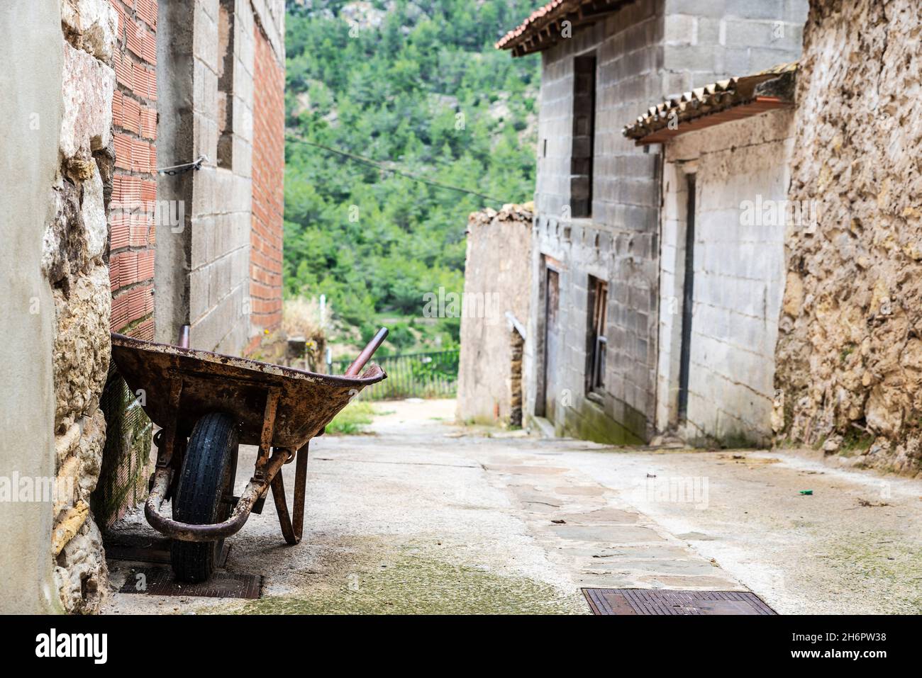 Old wheelbarrow on a street in the village of Puebla de Arenoso and Montanejos, Castellon, Land of Valencia, Spain Stock Photo