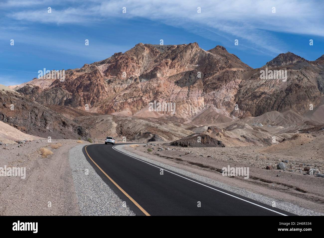 Road leading to the colorful geology of the Artist Palette rock formation in Death Valley National Park Stock Photo
