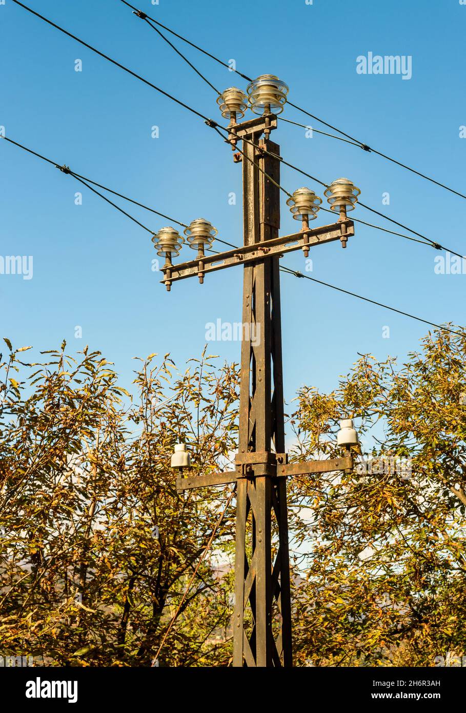 High voltage electricity pole against the blue sky Stock Photo - Alamy