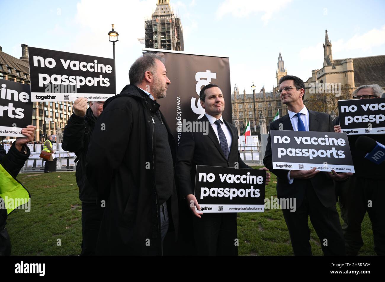 London, UK. 17 November 2021, Alan D Miller, Chris Green MP and Steve Baker MP support people should have Freedom of Choice against Vaccine Passports - No jab, no job, No jab, no travel is totall wrong against fundamental human rights in Parliament Square, 17 November 2021, London, UK. Stock Photo