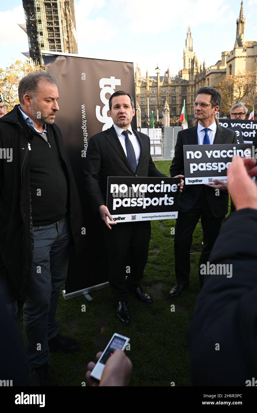 London, UK. 17 November 2021, Alan D Miller, Chris Green MP and Steve Baker MP support people should have Freedom of Choice against Vaccine Passports - No jab, no job, No jab, no travel is totall wrong against fundamental human rights in Parliament Square, 17 November 2021, London, UK. Stock Photo