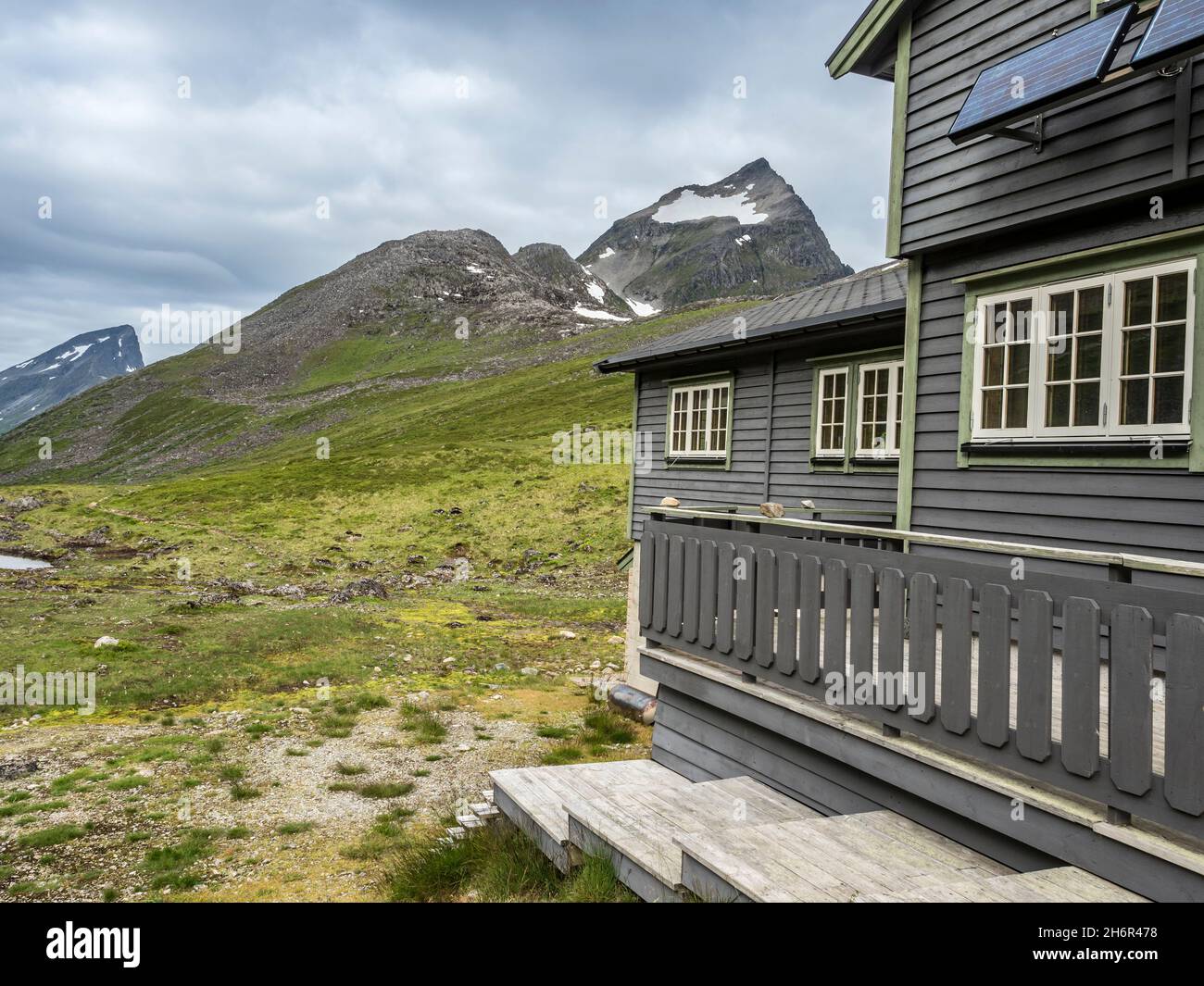 Mountain cabin Patchellhytta, mt. Slogen in the back, near Urke at the Hjorundfjord, Norway Stock Photo