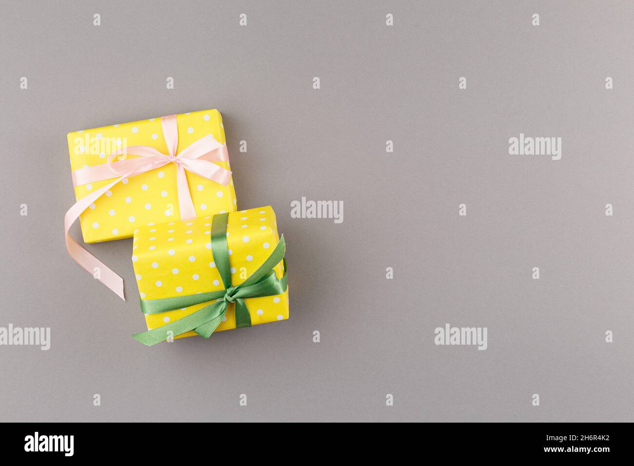 Gifts in yellow wrapping paper Stock Photo Alamy